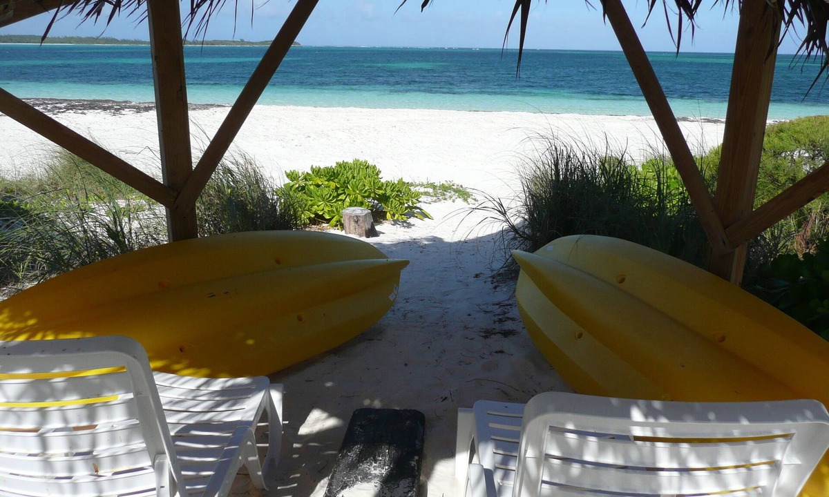 Winding Bay Villa | A luxury beachfront villa, surrounded by palms, with superb views of Winding Bay
