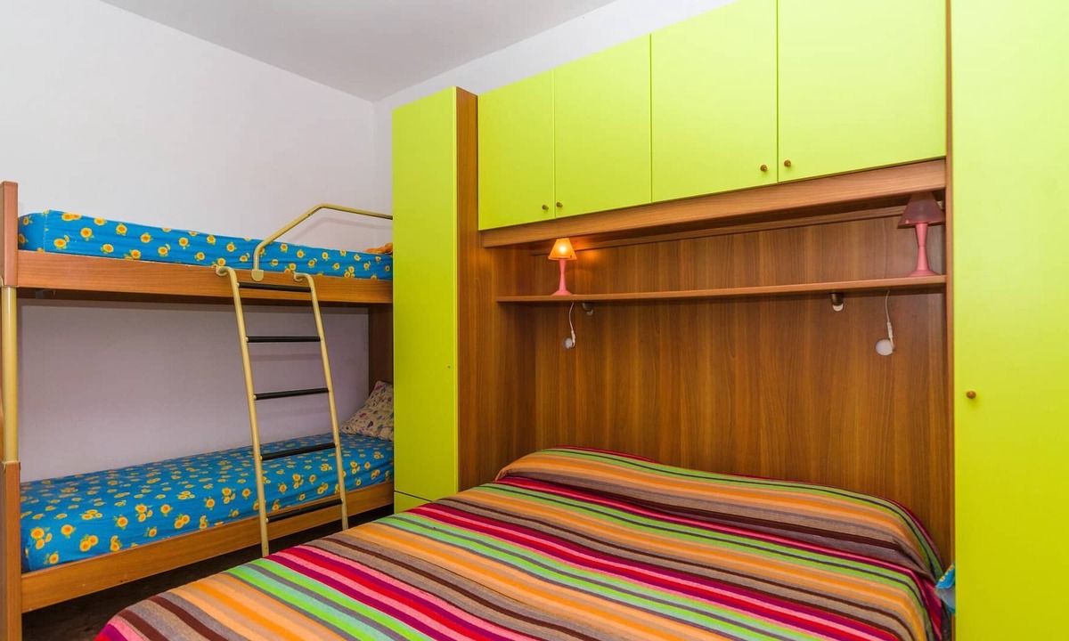 Bibione Pineda Apartment | Gabbiano tree-room flat surrounded by the green of the quite pine forest