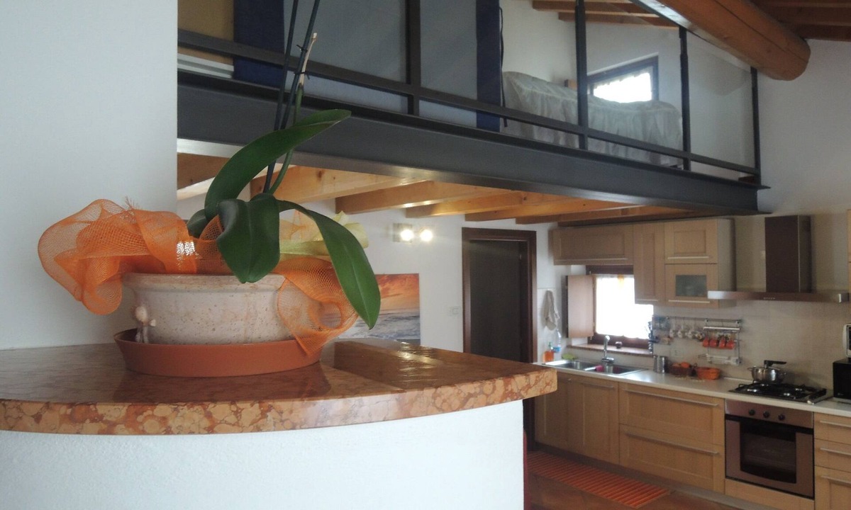 Pescantina Apartment | Ideal for Spa, food and wine tours. Italian breakfast included on bank of river