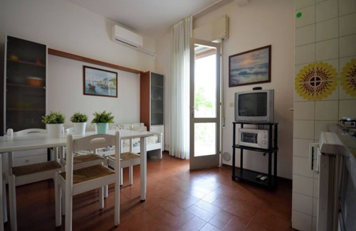 Bibione Pineda Apartment | Delightful two room apartment in a building close to the beach