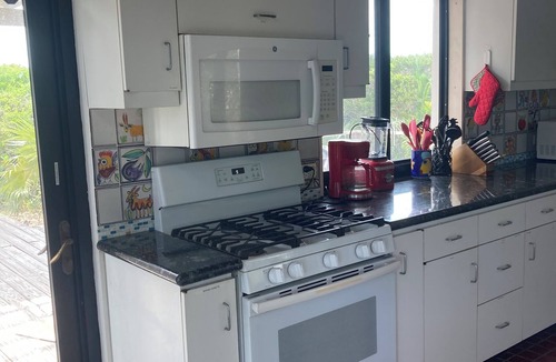 Great Exuma House | 4acres ON beach no drive 4 bedroom pool hot tub gym 3.5 baths 3+3outdoor showers