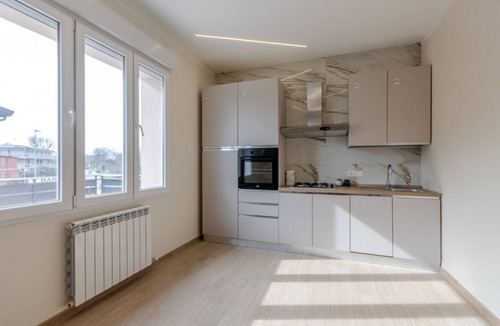 Tessera Apartment | A bright and welcoming 90 square meters apartment, perfect for seven people, located on the first floor of a building without an elevator.The property is located in Tessera, a suburb close to Marco Polo Airport. The location is also ideal for reaching Ve
