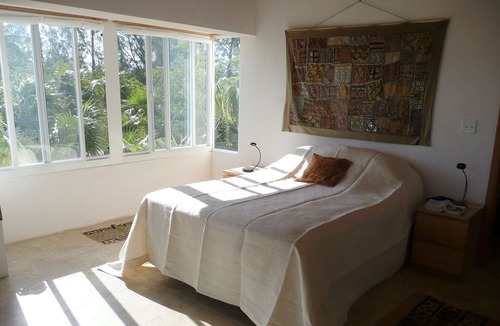 Winding Bay Villa | A luxury beachfront villa, surrounded by palms, with superb views of Winding Bay