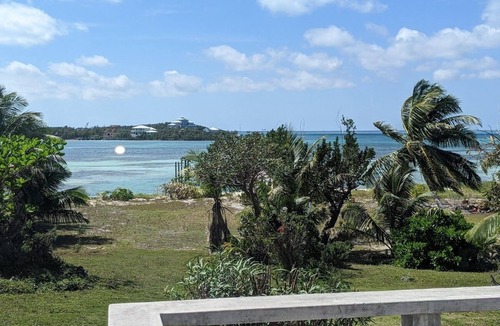Green Turtle Cay Cottage | Adorable Pink cottage-OCEAN FRONT on Coco Bay with a dock. 25% fall discount!