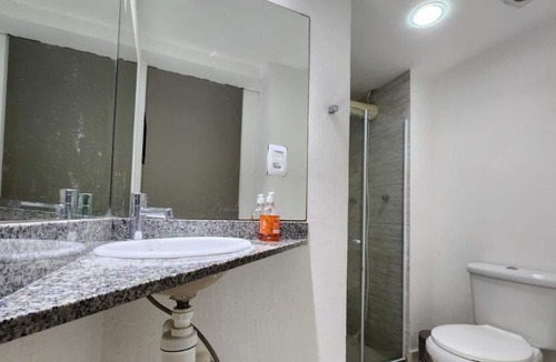 Camboinhas Apartment | Apart Hotel Alecrim Praia de Camboinhas with Marina standing on the sand