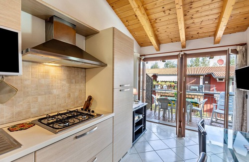 Ronchi Apartment | Apartment 'Residence La Corte' with Shared Pool, Balcony and Air Conditioning