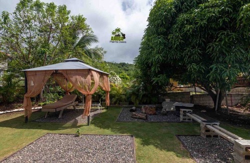 Mammee Bay House | Backyard Oasis in Drax Hall 70in TV