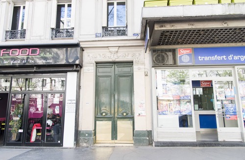 Saint-Vincent-de-Paul Apartment | Balcony Over The Tree-Lined Boulevard, by Veeve