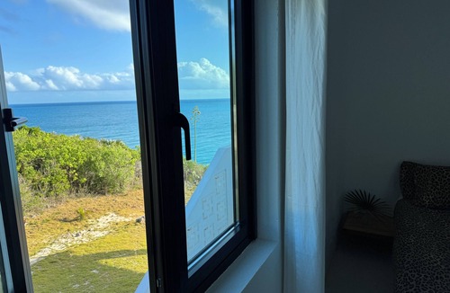 Gregory Town House | Big Pink:nmid-century modern 2bedroom oceanfront home on cliffs of Gregory Town