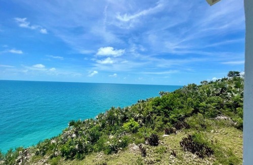 Gregory Town House | Big Pink:nmid-century modern 2bedroom oceanfront home on cliffs of Gregory Town