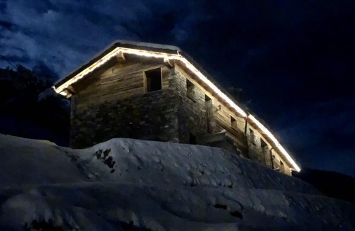 Valtellina Cabin | Characteristic lodge surrounded by nature near the ski facilities.
