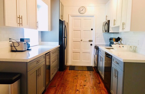 Alice Town House | COZY SEASIDE 2 BED/2 BATH BIMINI COTTAGE-BAY SIDE VIEW -soft green colored house