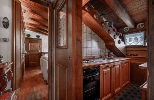 Cortina d'Ampezzo Historic Centre Apartment | GuestHost - Charming 45 sqm apartment, with fine wooden finishes and mountain view, ideal for two guests, located on the 4th floor of a characteristic building. The property is located in the heart of Cortina, along the famous Corso Italia, a 7-minute wa