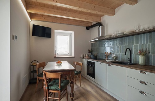 Cerete Apartment | Historic 1940s Watermill: A Designer Retreat in the Italian Alps