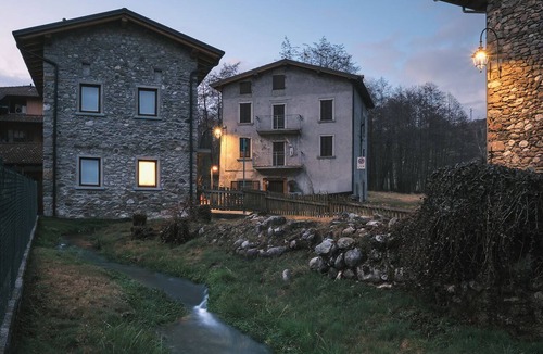 Cerete Apartment | Historic 1940s Watermill: A Designer Retreat in the Italian Alps