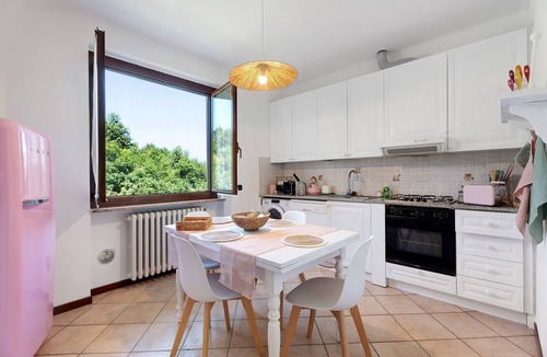 Angera House | Holiday Home 'Villa Fox' with Garden, Balcony & Shared Wi-Fi
