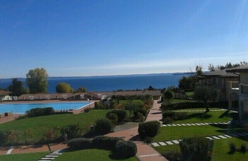 Solarolo Apartment | Montecolo Resort three-room apartment with splendid lake view, swimming pool
