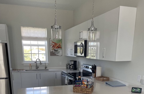 Palm Cay Condo | New Luxury 3 bedroom villa steps from the beach.