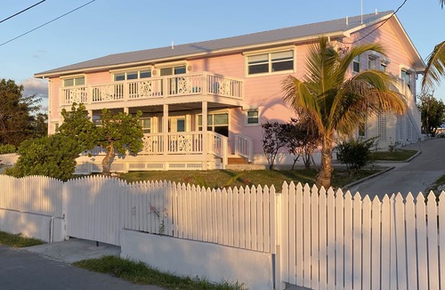 Treasure Cay House | Pink Bikini Island Cottage with a dock on Black Sound
