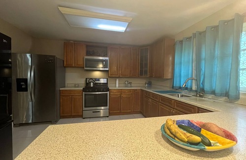Bahamas Terrace House | Quiet getaway near Xanadu Beach, Freeport with Central Air, WiFi & free parking.