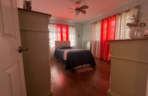 Bahamas Terrace House | Quiet getaway near Xanadu Beach, Freeport with Central Air, WiFi & free parking.