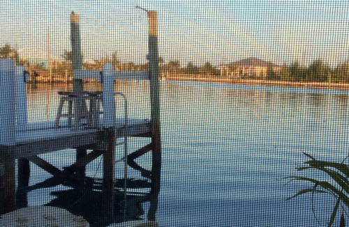 Treasure Cay Villa | Romantic cozy boathouse on the water surrounded by tropical gardens