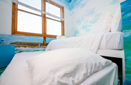 Queens Condo | The High Tide Studio #6 Studio Bedroom Hotel Room by RedAwning
