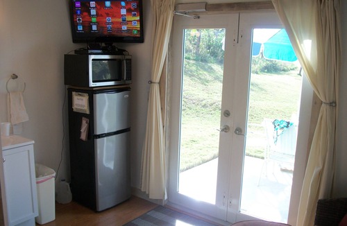 Dunmore Town House | Tiny House Vacation, Bayfront with private beach area! On two secluded acres!