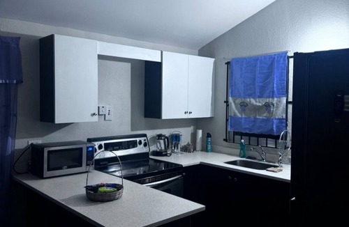 Spring Village House | Ts Staycation - a charming 2-bedroom house with WiFi, AC in Spanish Town