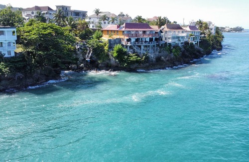 Tower Isle Apartment | Wake up to panoramic ocean views & relax by your own private jetty steps away.n