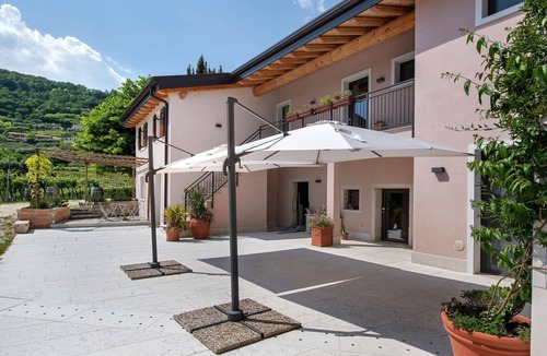 Negrar Apartment | Wine Room with Shared Garden, Wi-Fi and Air Conditioning