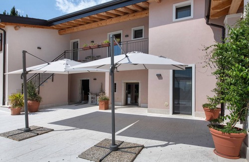 Negrar Apartment | Wine Room with Shared Garden, Wi-Fi and Air Conditioning