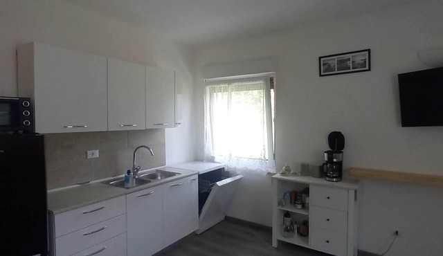 Surrounded by nature, cozy apartment with private garden and grill area