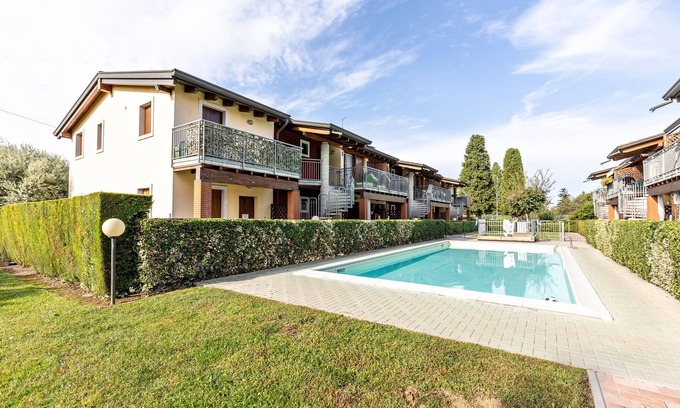 Ronchi Apartment | Apartment 'Residence La Corte' with Shared Pool, Balcony and Air Conditioning