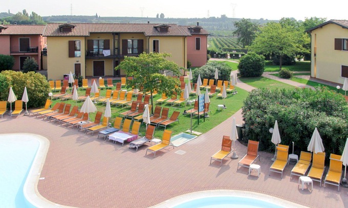 Castelnuovo del Garda Apartment | Beautiful apartment for 4 guests with pool, A/C, hot tub, WIFI, TV, terrace and pets allowed